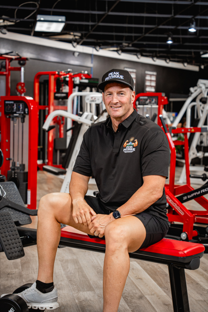 Pat in his gym with workout equipment.